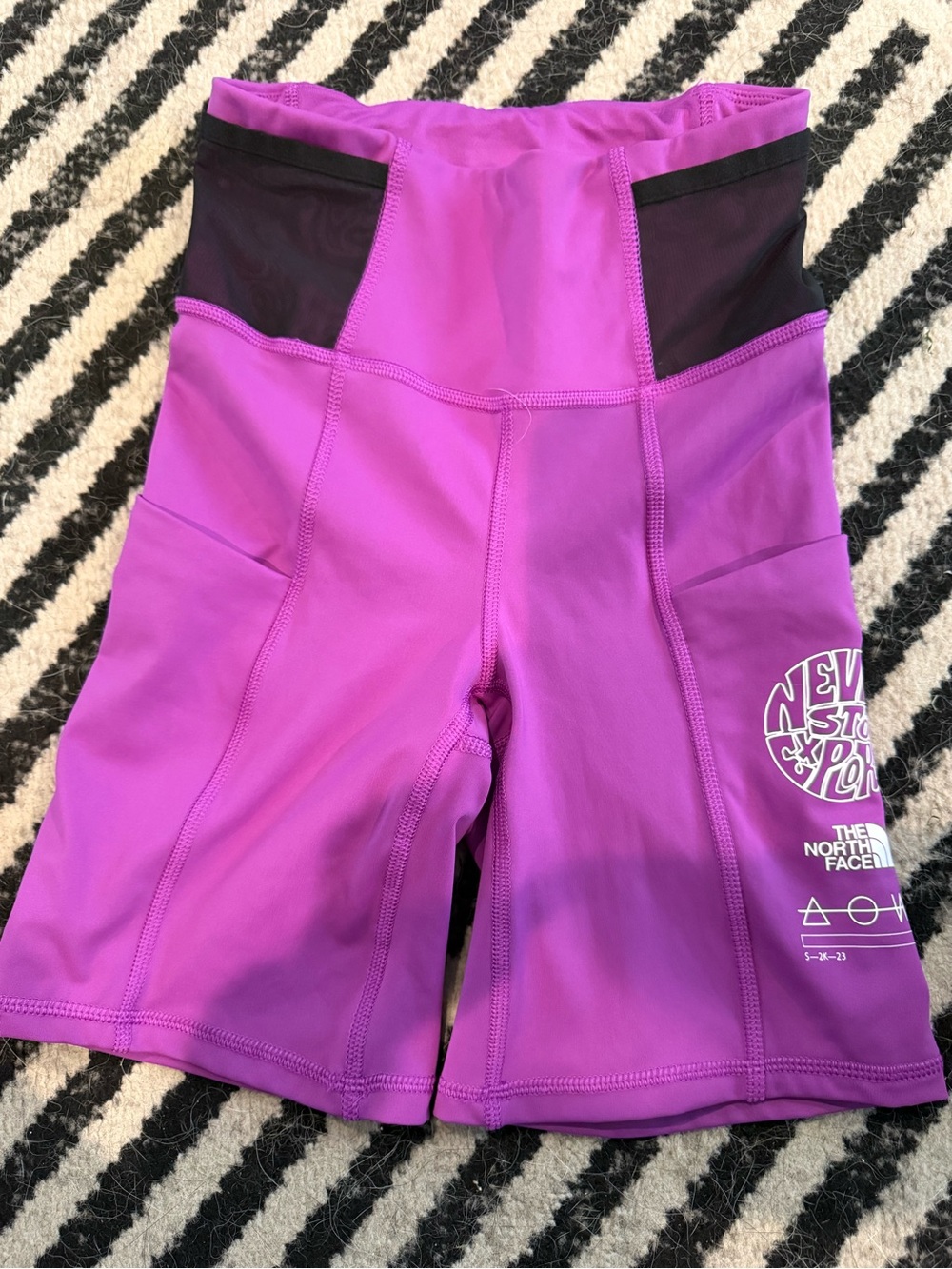The North Face Women's Magenta/Purple High-Rise Bike Shorts with Side Pockets